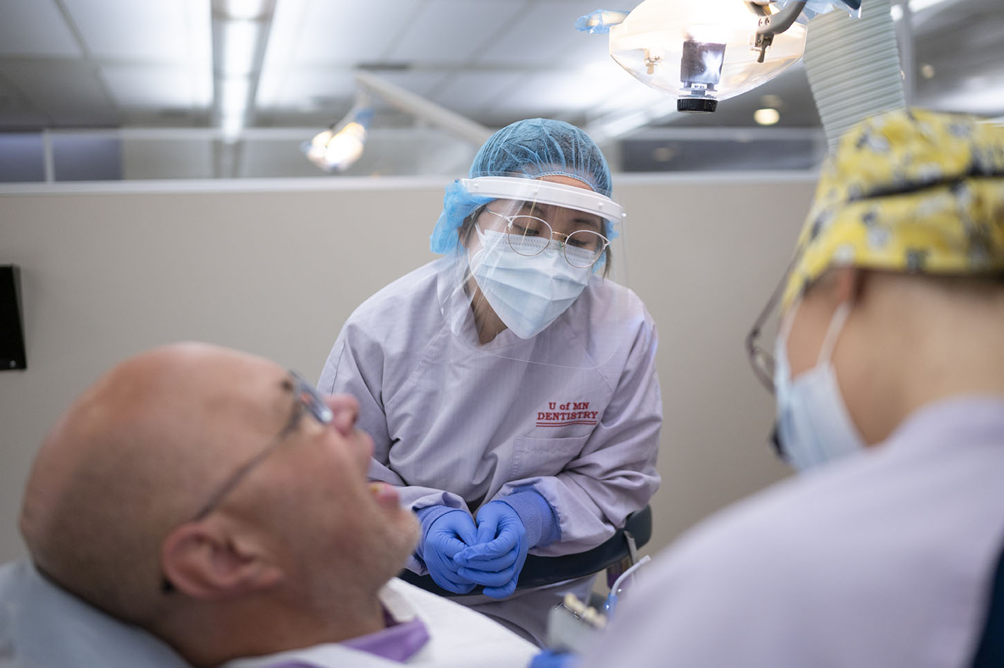 Dentists caring for a patient
