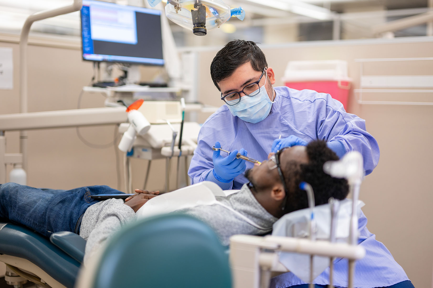 Graduate Periodontics resident cares for a patient